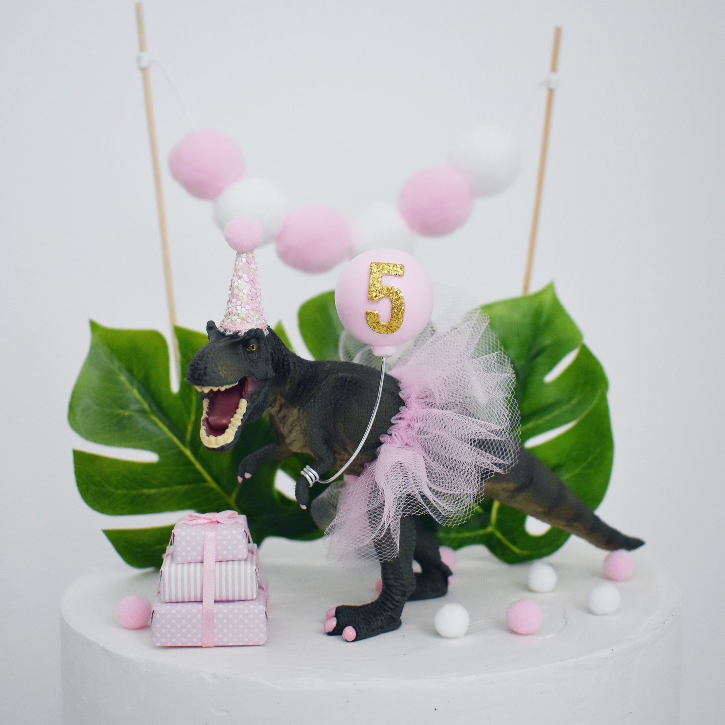 pink trex cake decoration