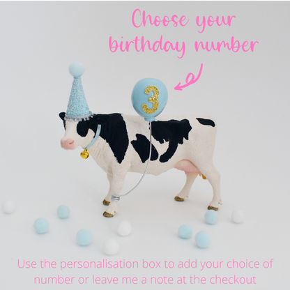 cow with party hat cake topper