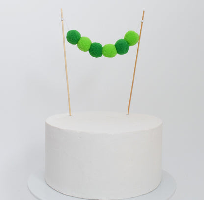 green pom pom cake garland