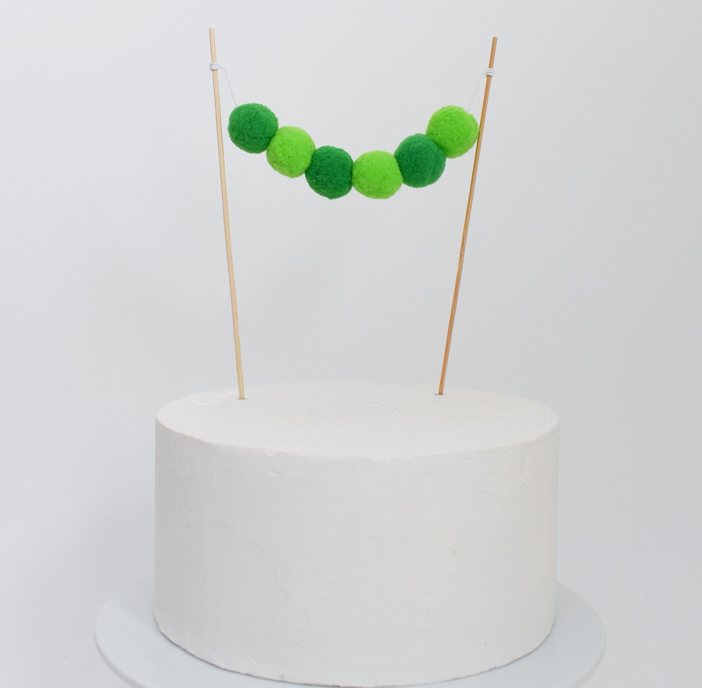 Pom Pom Garland Cake Topper in Green