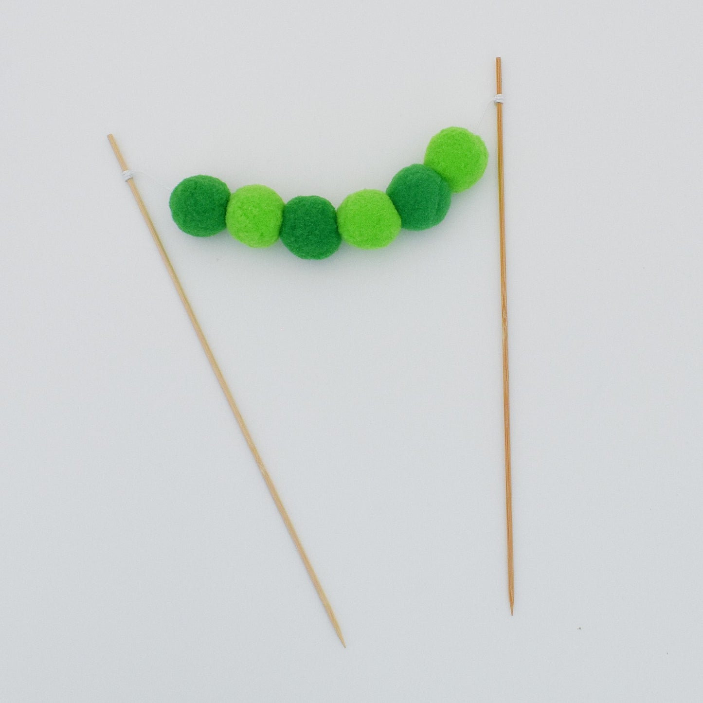 Pom Pom Garland Cake Topper in Green