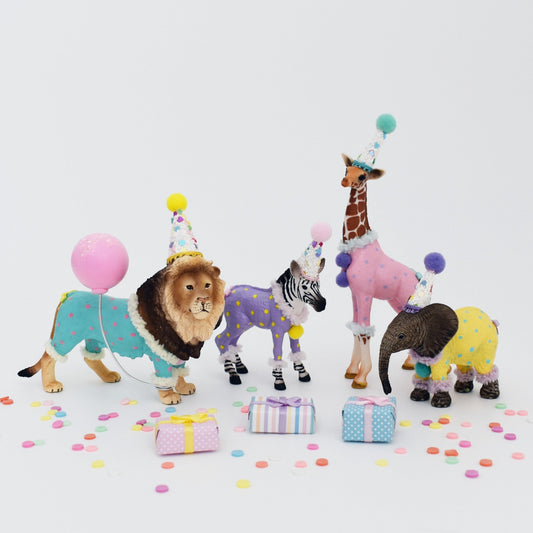 safari animal cake toppers with painted outfits
