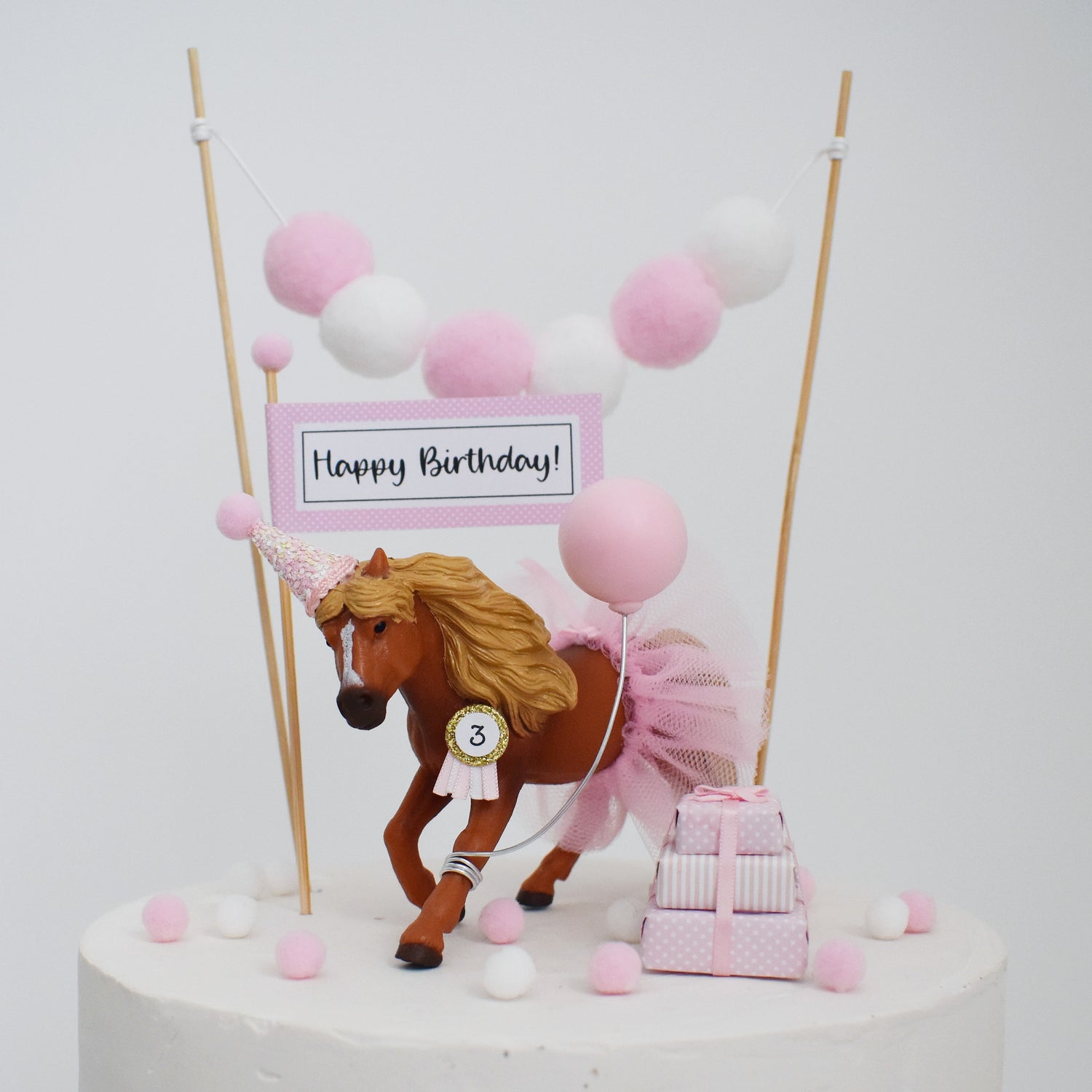 pink horse cake topper with balloon