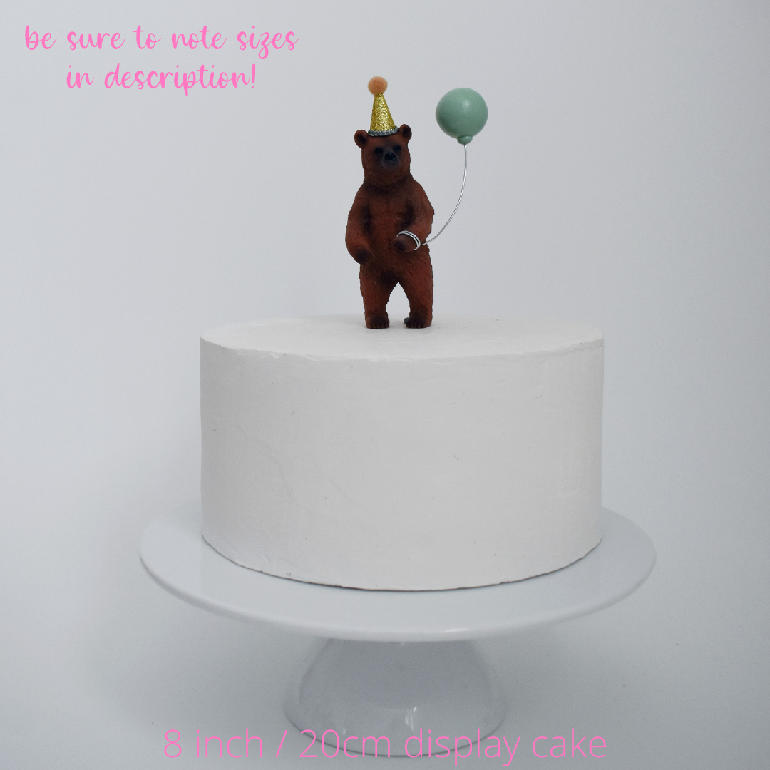 bear cake topper with party hat