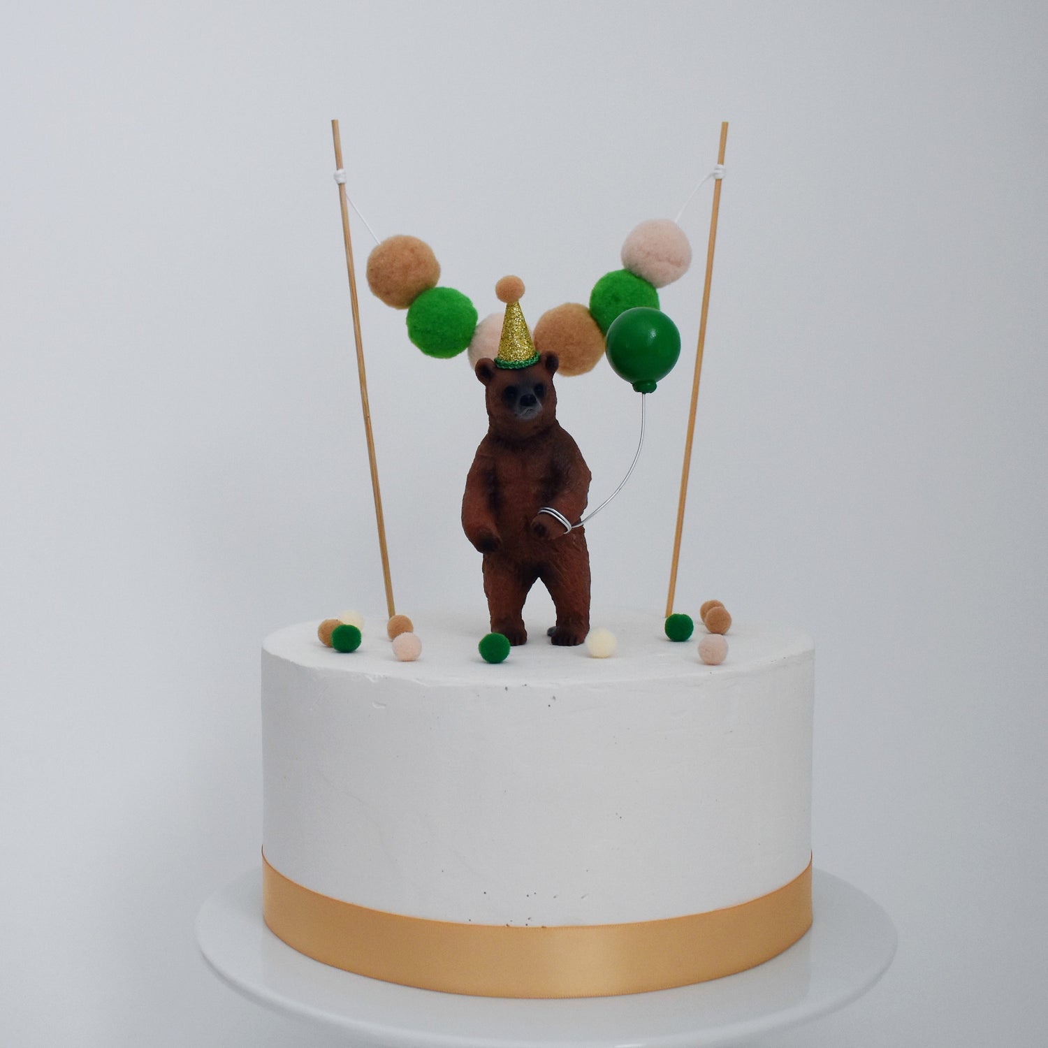 green and gold bear cake topper
