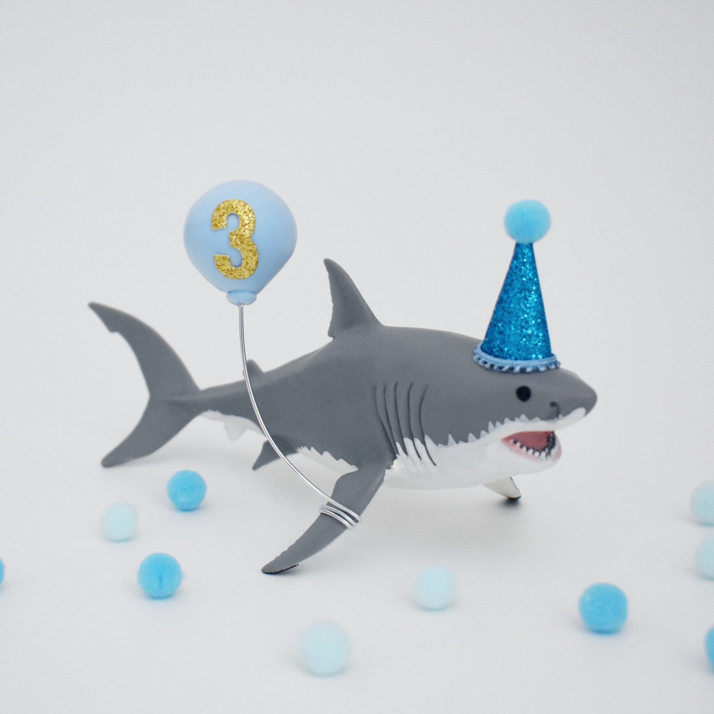 shark cake topper with party hat and balloon