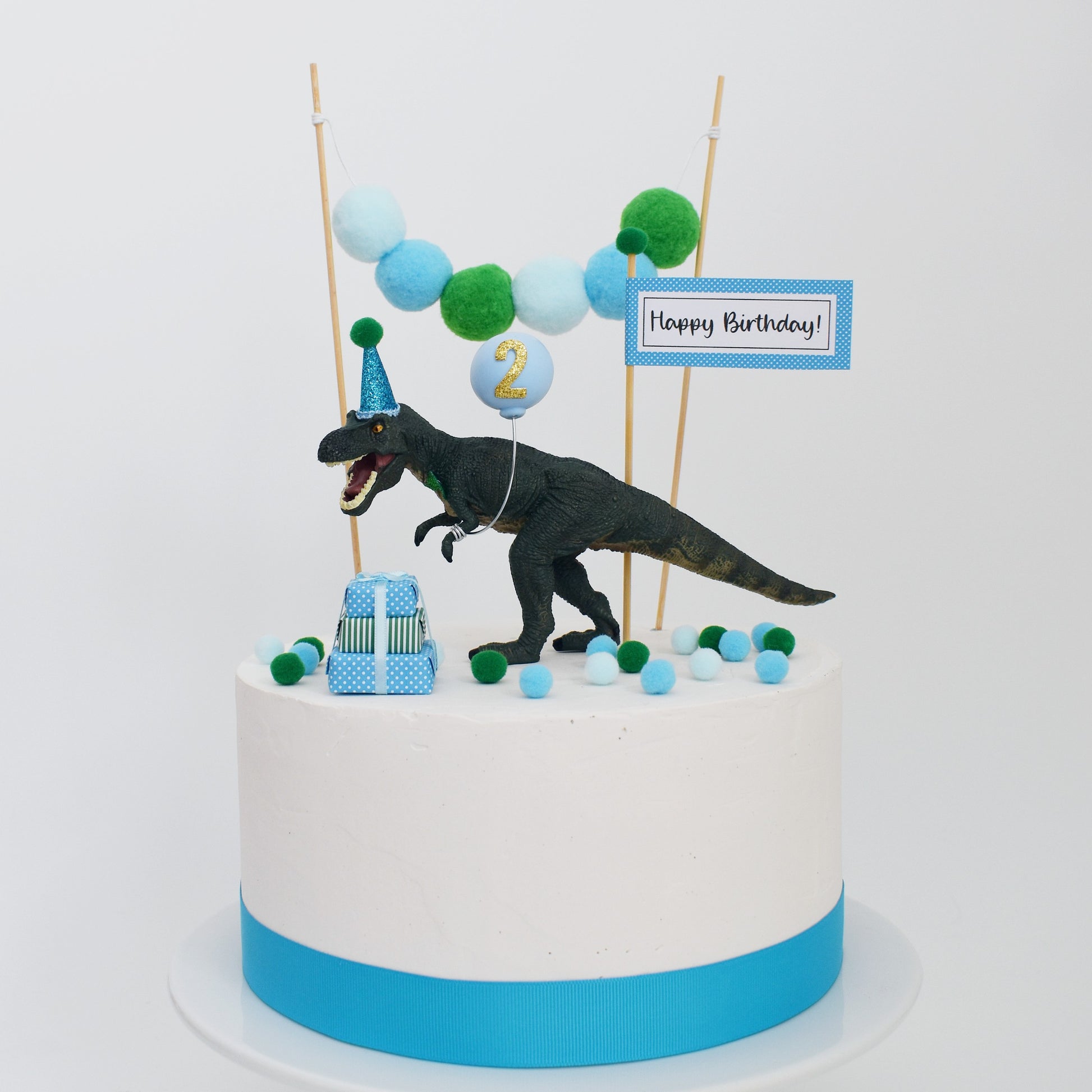 dinosaur with ballloon cake topper