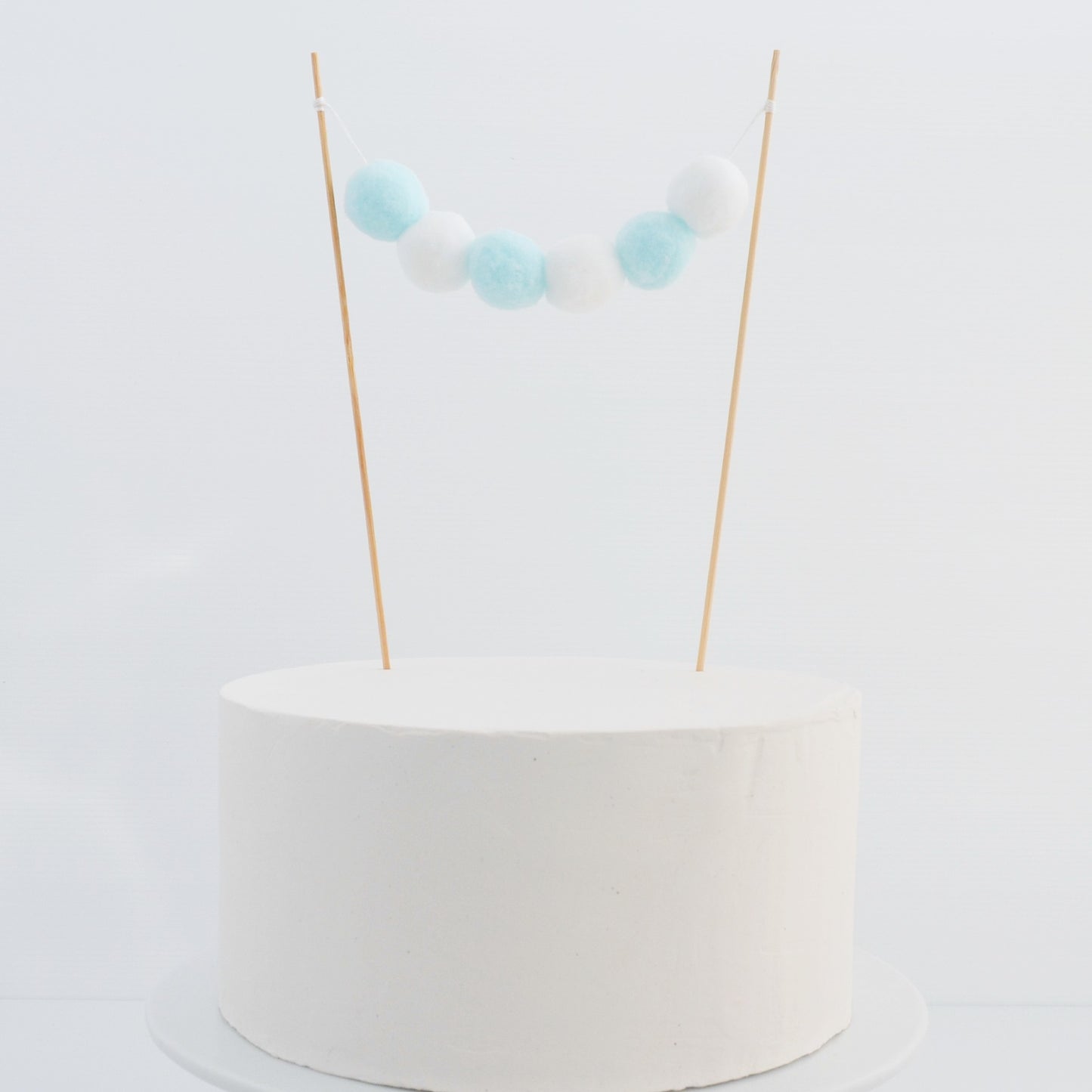 blue and white cake topper garland
