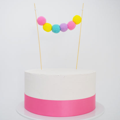 rainbow pom pom garland cake topper